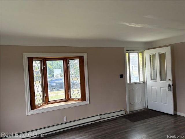 5873 Elmgrove Ave, Warren, MI 48092 - entrance foyer featuring a baseboard heating unit and dark wood finished floors