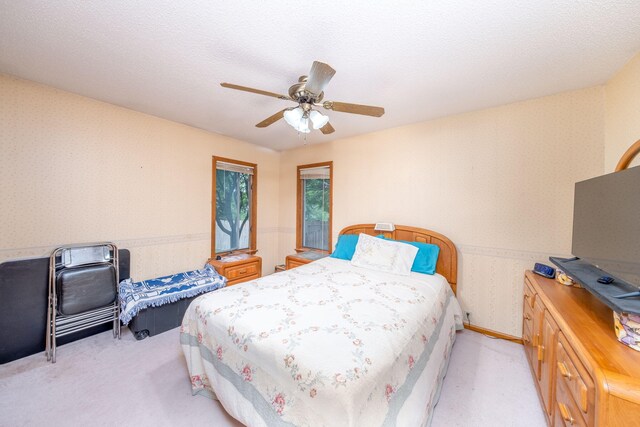 616 N Lincoln Ave, Lakeview, MI 48850 - bedroom with wallpapered walls, light carpet, and a ceiling fan