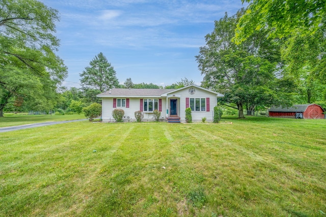 616 N Lincoln Ave, Lakeview, MI 48850 - ranch-style home with a front yard and a shed