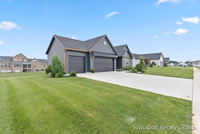 8056 Tramway Dr SW, Byron Center, MI 49315 - view of front of property featuring an attached garage, driveway, and a residential view