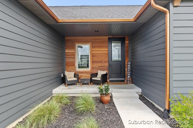 8056 Tramway Dr SW, Byron Center, MI 49315 - view of exterior entry with a shingled roof