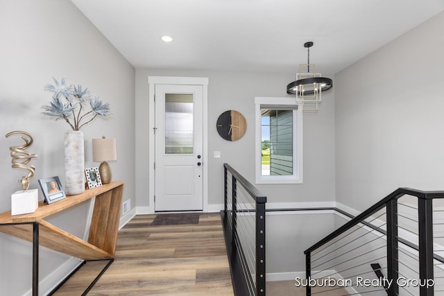 8056 Tramway Dr SW, Byron Center, MI 49315 - entryway with wood finished floors, recessed lighting, and a chandelier