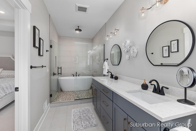 8056 Tramway Dr SW, Byron Center, MI 49315 - bathroom with tile patterned flooring, double vanity, a shower stall, a freestanding tub, and ensuite bathroom