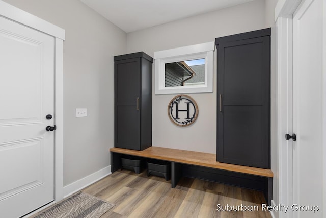 8056 Tramway Dr SW, Byron Center, MI 49315 - mudroom featuring light wood finished floors and baseboards