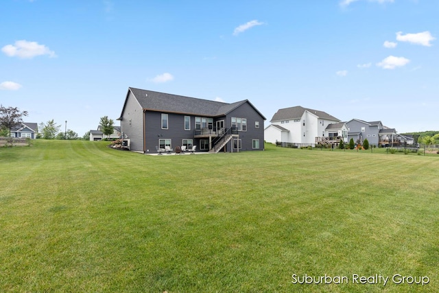 8056 Tramway Dr SW, Byron Center, MI 49315 - rear view of property with stairway, a residential view, and a deck