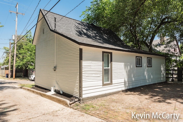 214 Bradford St NE, Grand Rapids, MI 49503 - view of property exterior with roof with shingles