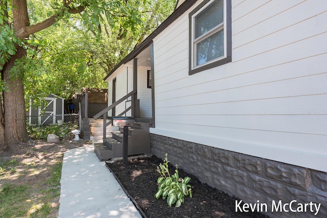 214 Bradford St NE, Grand Rapids, MI 49503 - view of home's exterior with a storage unit
