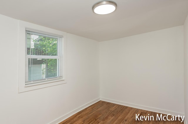 214 Bradford St NE, Grand Rapids, MI 49503 - empty room with baseboards and wood finished floors