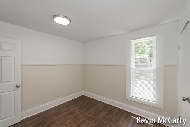 214 Bradford St NE, Grand Rapids, MI 49503 - unfurnished room featuring dark wood-style flooring and baseboards