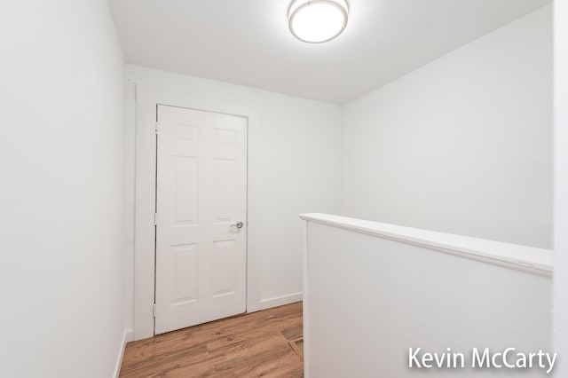 214 Bradford St NE, Grand Rapids, MI 49503 - hall featuring light wood finished floors and baseboards