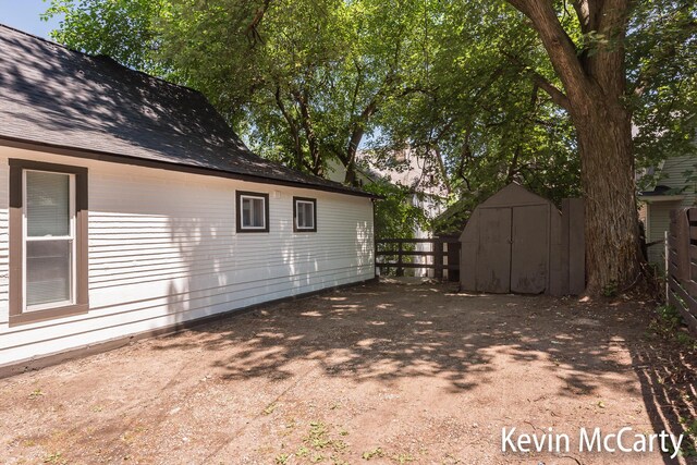 214 Bradford St NE, Grand Rapids, MI 49503 - view of home's exterior with a storage shed