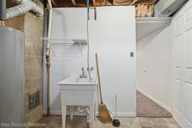 147 Euclid St, Mount Clemens, MI 48043 - bathroom featuring baseboards and concrete block wall