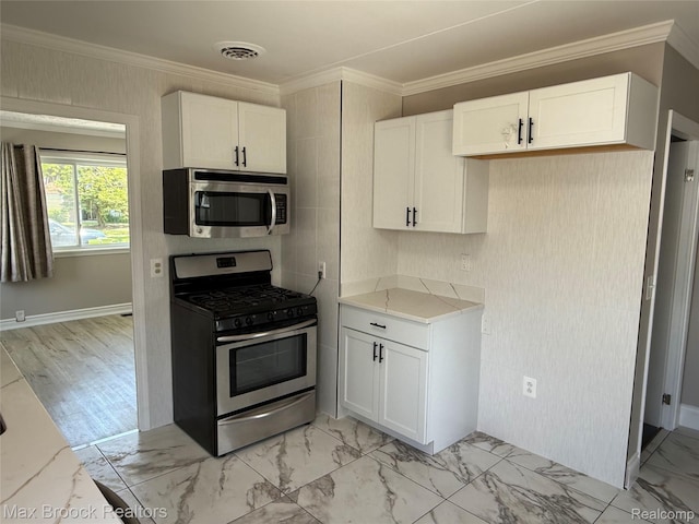 147 Euclid St, Mount Clemens, MI 48043 - kitchen with stainless steel appliances, white cabinets, light marble finish floors, and ornamental molding