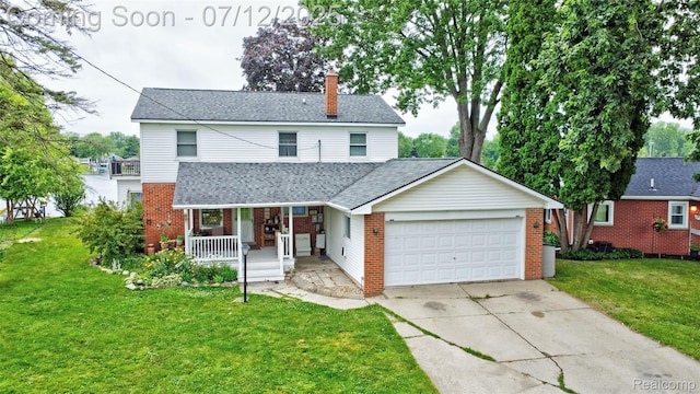 1962 Lake Pointe Dr, Ortonville, MI 48462 - traditional-style home featuring covered porch, brick siding, a garage, and a chimney