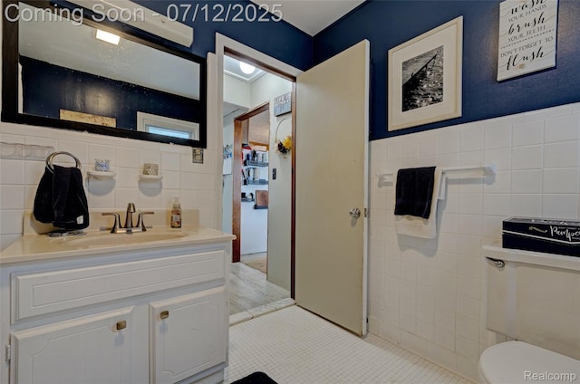 1962 Lake Pointe Dr, Ortonville, MI 48462 - bathroom featuring tile walls, vanity, and tile patterned flooring