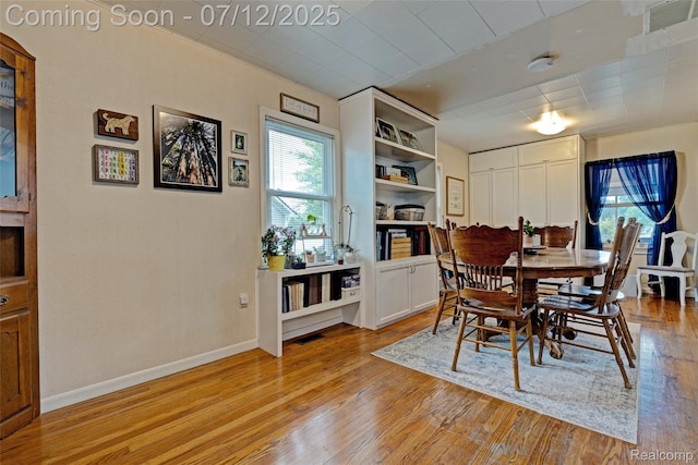 1962 Lake Pointe Dr, Ortonville, MI 48462 - dining room featuring light wood finished floors and baseboards