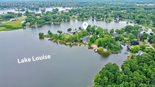 1962 Lake Pointe Dr, Ortonville, MI 48462 - drone / aerial view of a nearby body of water and a tree filled landscape