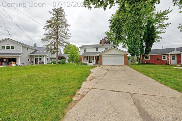 1962 Lake Pointe Dr, Ortonville, MI 48462 - traditional-style home with brick siding, driveway, a front lawn, covered porch, and a garage