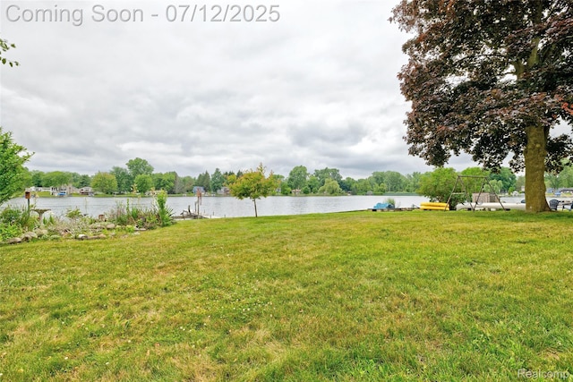 1962 Lake Pointe Dr, Ortonville, MI 48462 - view of green lawn with a water view