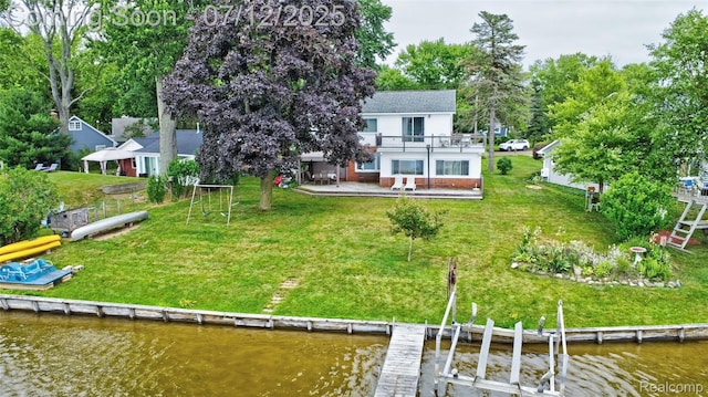 1962 Lake Pointe Dr, Ortonville, MI 48462 - back of property featuring a deck with water view and view of scattered trees