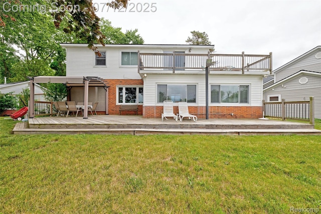 1962 Lake Pointe Dr, Ortonville, MI 48462 - back of property with a balcony, brick siding, a wooden deck, and a lawn
