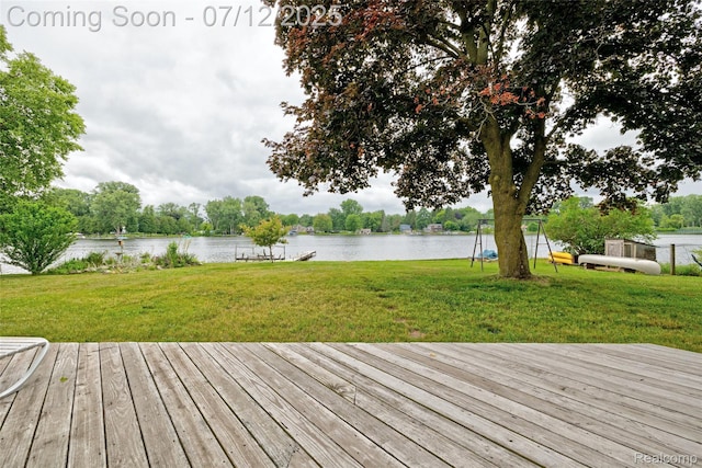 1962 Lake Pointe Dr, Ortonville, MI 48462 - wooden deck featuring a water view and a yard