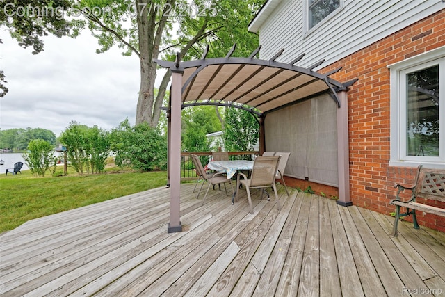 1962 Lake Pointe Dr, Ortonville, MI 48462 - deck featuring outdoor dining space and a lawn