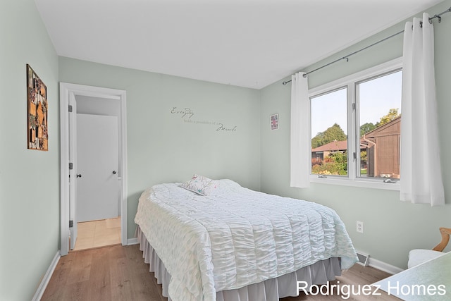 2106 Cranbrook Dr NE, Grand Rapids, MI 49505 - bedroom with baseboards and wood finished floors