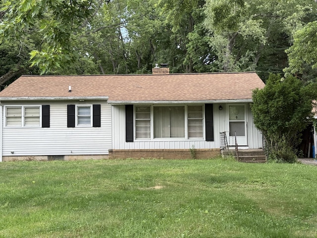 6429 Wendell St SE, Grand Rapids, MI 49546 - ranch-style home with a chimney, a front yard, and roof with shingles