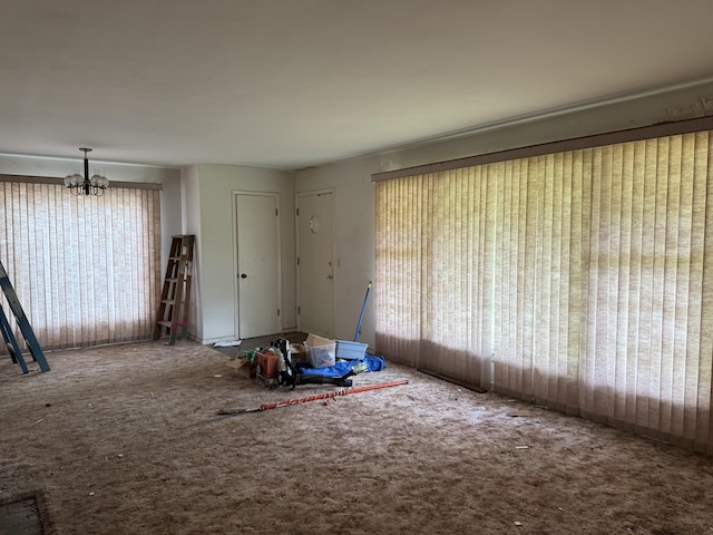 6429 Wendell St SE, Grand Rapids, MI 49546 - unfurnished room with a chandelier, healthy amount of natural light, and carpet floors