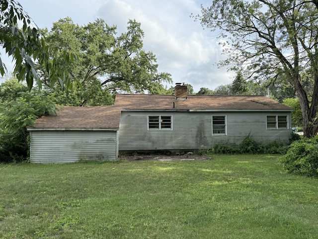6429 Wendell St SE, Grand Rapids, MI 49546 - back of property featuring a yard and a chimney