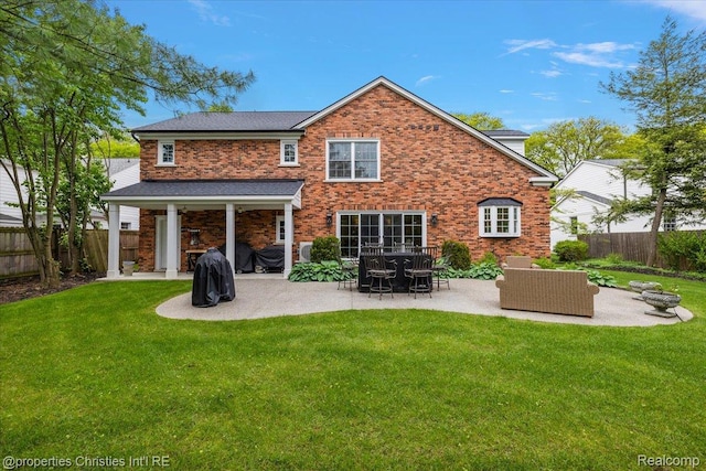 586 Fairfax St, Birmingham, MI 48009 - rear view of property featuring a patio area, a fenced backyard, and brick siding