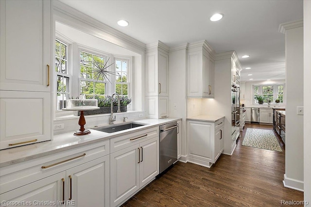 586 Fairfax St, Birmingham, MI 48009 - kitchen featuring appliances with stainless steel finishes, dark wood-style flooring, white cabinets, recessed lighting, and light countertops
