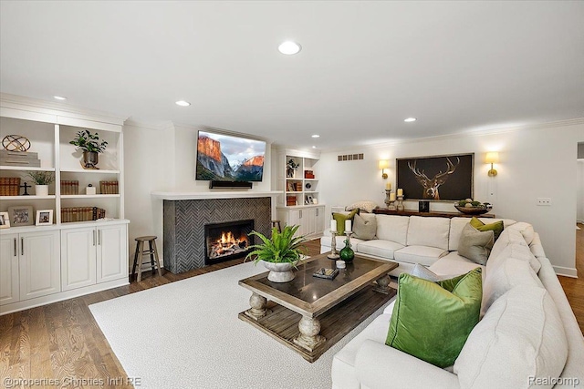 586 Fairfax St, Birmingham, MI 48009 - living area featuring crown molding, wood finished floors, a fireplace, and recessed lighting