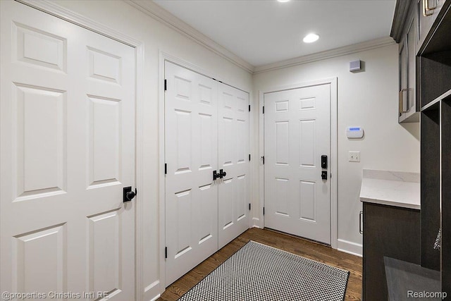 586 Fairfax St, Birmingham, MI 48009 - entryway with crown molding, dark wood-style flooring, and recessed lighting