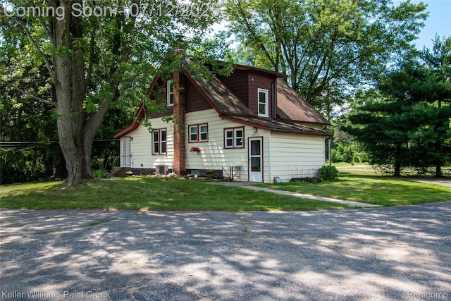 20525 30 Mile Rd, Ray, MI 48096 - view of home's exterior featuring a lawn and a central AC unit