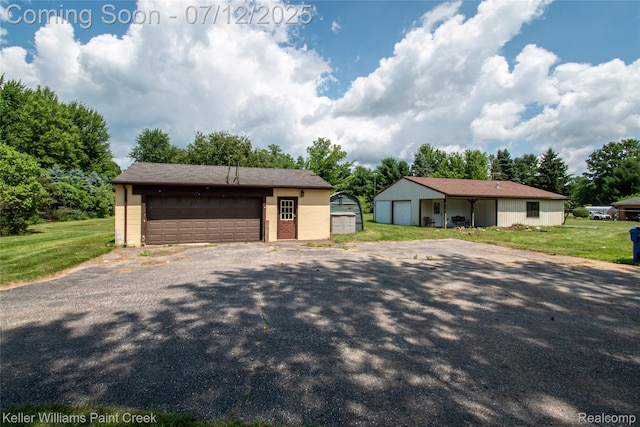 20525 30 Mile Rd, Ray, MI 48096 - view of front facade with a detached garage, an outdoor structure, and a front yard