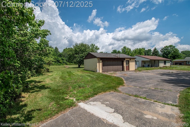 20525 30 Mile Rd, Ray, MI 48096 - view of grassy yard featuring asphalt driveway