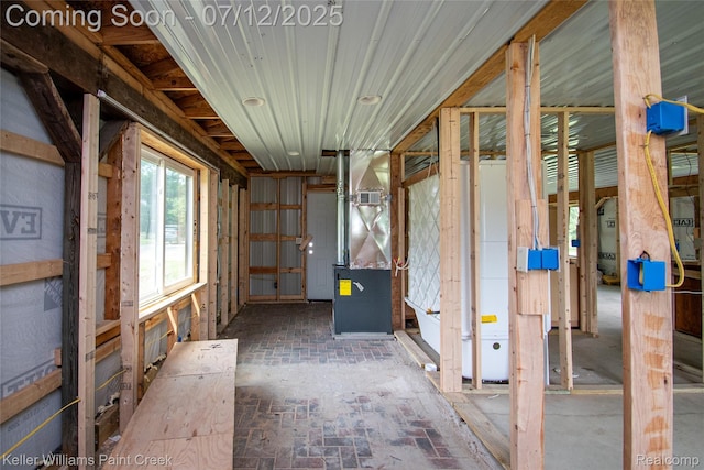 20525 30 Mile Rd, Ray, MI 48096 - miscellaneous room featuring brick floors and heating unit