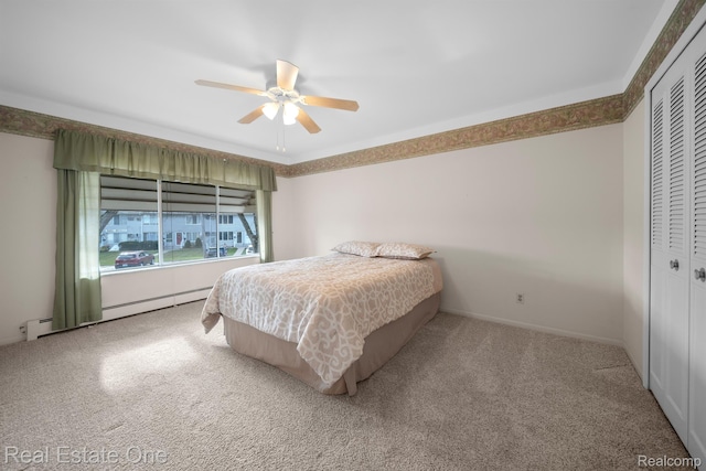 5980 Alan Dr Unit 6, Brighton, MI 48116 - bedroom with carpet floors, a closet, a baseboard radiator, and a ceiling fan