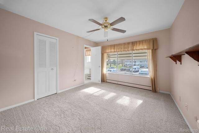 5980 Alan Dr Unit 6, Brighton, MI 48116 - unfurnished bedroom with a baseboard heating unit, carpet, and ceiling fan