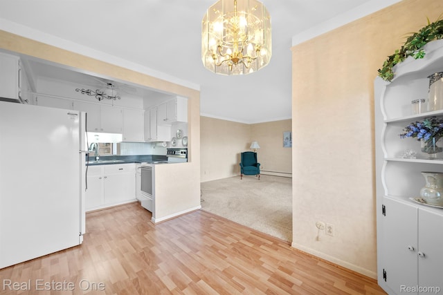 5980 Alan Dr Unit 6, Brighton, MI 48116 - kitchen featuring white appliances, a chandelier, light wood-style flooring, dark countertops, and white cabinetry