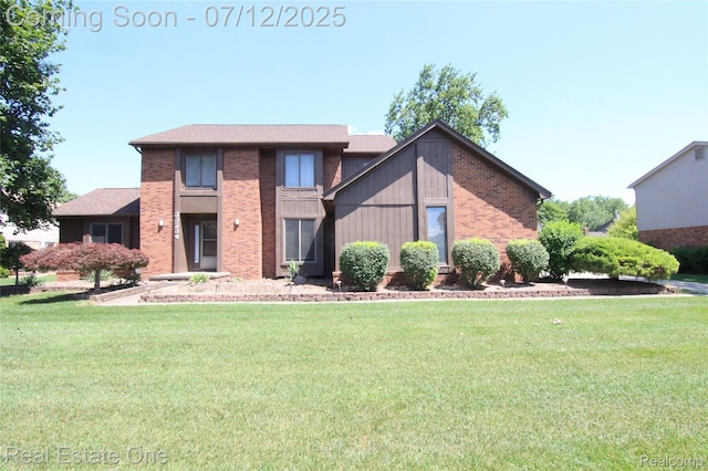 33234 Walnut Ln, Farmington Hills, MI 48334 - view of front of property featuring brick siding and a front lawn