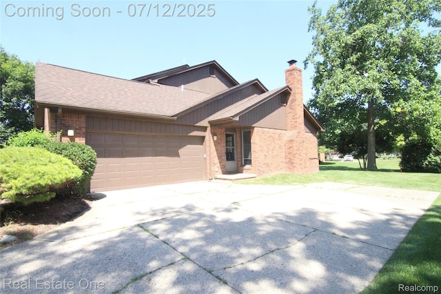 33234 Walnut Ln, Farmington Hills, MI 48334 - view of front facade featuring concrete driveway, a chimney, brick siding, and an attached garage