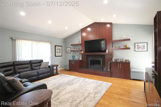 33234 Walnut Ln, Farmington Hills, MI 48334 - living area with vaulted ceiling, light wood-style flooring, a fireplace, and recessed lighting