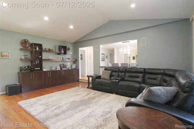 33234 Walnut Ln, Farmington Hills, MI 48334 - living room with light wood-type flooring, vaulted ceiling, and recessed lighting
