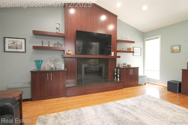 33234 Walnut Ln, Farmington Hills, MI 48334 - living area with wood finished floors, a fireplace, lofted ceiling, and recessed lighting