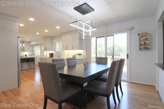 33234 Walnut Ln, Farmington Hills, MI 48334 - dining room with recessed lighting, healthy amount of natural light, and light wood-style floors
