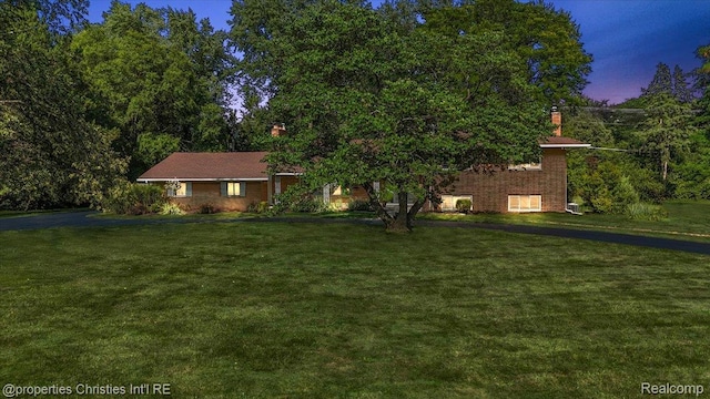 30700 Marimoor St, Beverly Hills, MI 48025 - view of front of property featuring a front lawn and a chimney