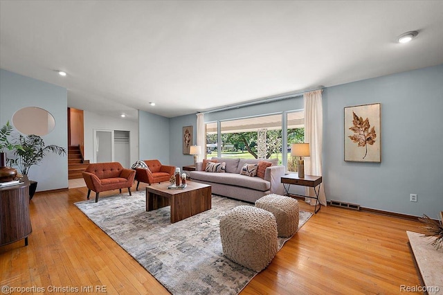 30700 Marimoor St, Beverly Hills, MI 48025 - living room featuring light wood finished floors, stairs, and recessed lighting